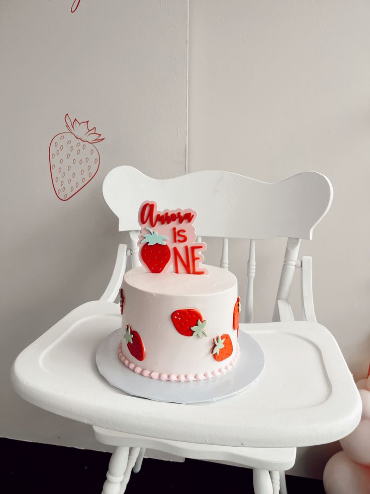 a cake sitting on top of a white chair