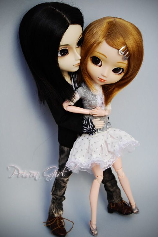 an image of two dolls that are hugging