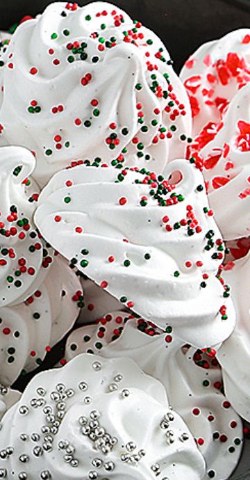 white frosted cupcakes with red and green sprinkles