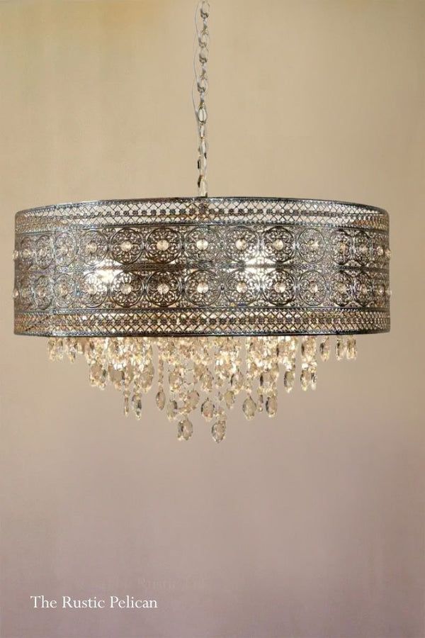 a chandelier hanging from the ceiling in a room