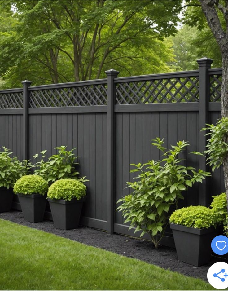 an image of a fence with potted plants