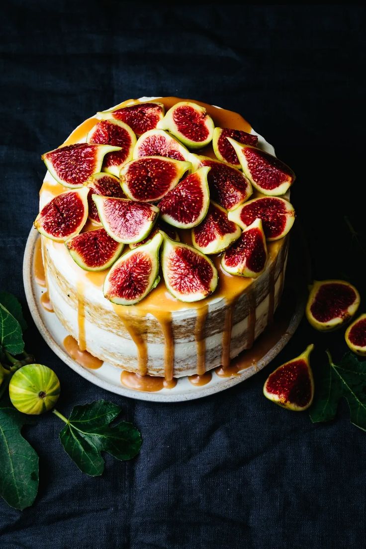 a cake with figs and caramel drizzled on top