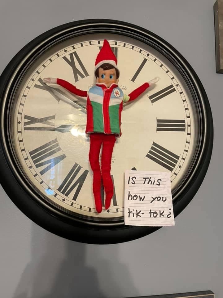 a clock with an elf painted on it and a note attached to the clock says, is this how you pick?