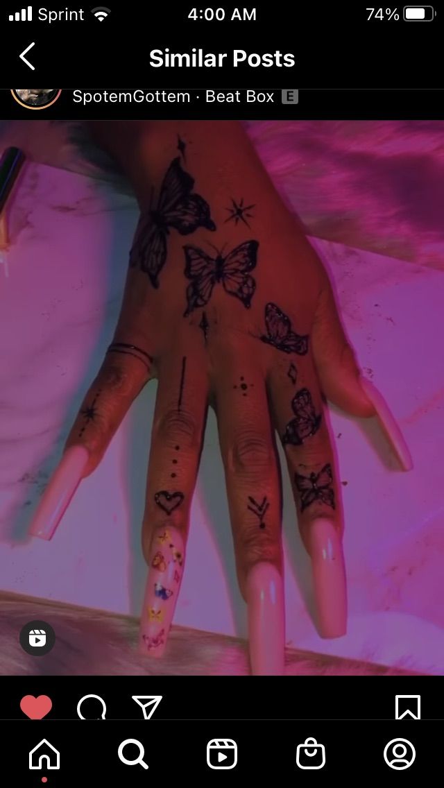 a person's hand with tattoos on it and the words similar posts above them