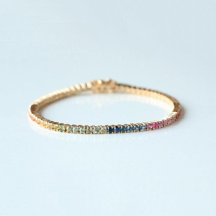 Attract To Your Loved Ones With This Beautiful Rainbow Sapphire Colorful Tennis Bracelet, Round Multi Color Prong Set Bracelet Jewelry, Trendy Bracelet For Women, Handmade Fine Jewelry, Ombre Tennis Bracelet. Great Gift For Christmas, Cyber Sale, Cyber Monday and Black Friday. Octagon Cut Rainbow Sapphire Bracelet 👇 https://www.etsy.com/listing/1530336725 Also available in Yellow Gold, Rose Gold and White Gold. Pretty Gift For Mom, Sister, Friend and Girlfriend. 𝐏𝐫𝐨𝐝𝐮𝐜𝐭 𝐢𝐧𝐟𝐨: 𝟏𝟒𝐤 Rainbow Gemstone Bracelet, Elegant Rainbow Round Bracelets, Multicolor Diamond Bracelet As A Gift, Fine Jewelry Multicolor Wedding Bracelet, Multicolor Bangle Bracelets For Anniversary, Multicolor Fine Jewelry Bracelet For Wedding, Multicolor Multi-stone Gold Bracelet As Gift, Yellow Gold Multi-stone Bracelets For Wedding, Fine Jewelry Multicolor Tennis Bracelet With Jubilee Style