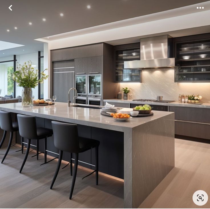 a large kitchen with an island and lots of counter space