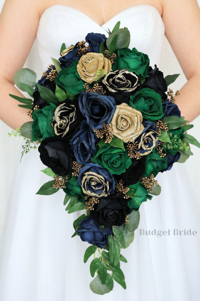 a bridal holding a bouquet of flowers and greenery