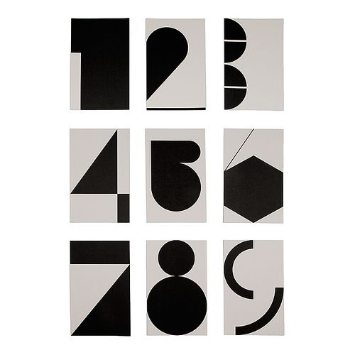 nine black and white squares with numbers in the middle one has an abstract design on it