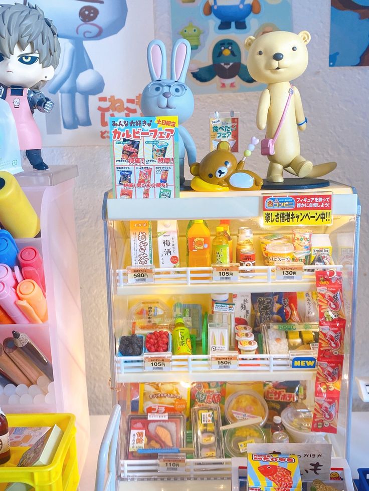 there are many toys on display in this toy store's merchandise section, including an ice cream cart