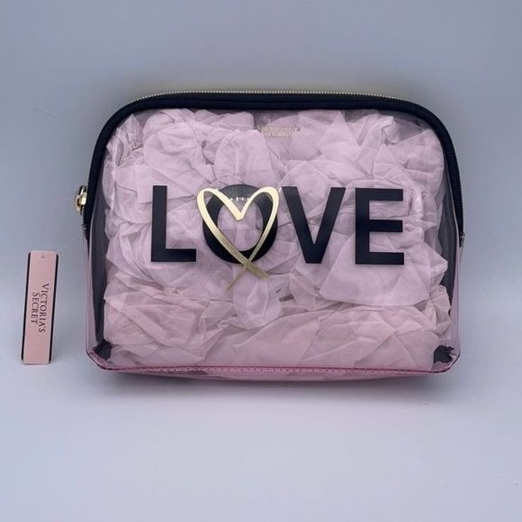 Victoria’s Secret Clear With A Pink Cast Makeup Up Cosmetic Bag Or Great If You Have To Use A Clear Bag For Work Zip Top With Strap Love With A Gold Heart Across The Front Pics Are Shown How It Came Protected And Stuffed With Paper Measures 8.5” Wide X 7” Tall New With Tags Smoke Free Home Hanging Cosmetic Bag, Heart Makeup, Mini Makeup Bag, Clear Cosmetic Bag, Travel Bag Set, Large Makeup Bag, Clear Makeup Bags, Makeup Storage Bag, Leather Makeup Bag