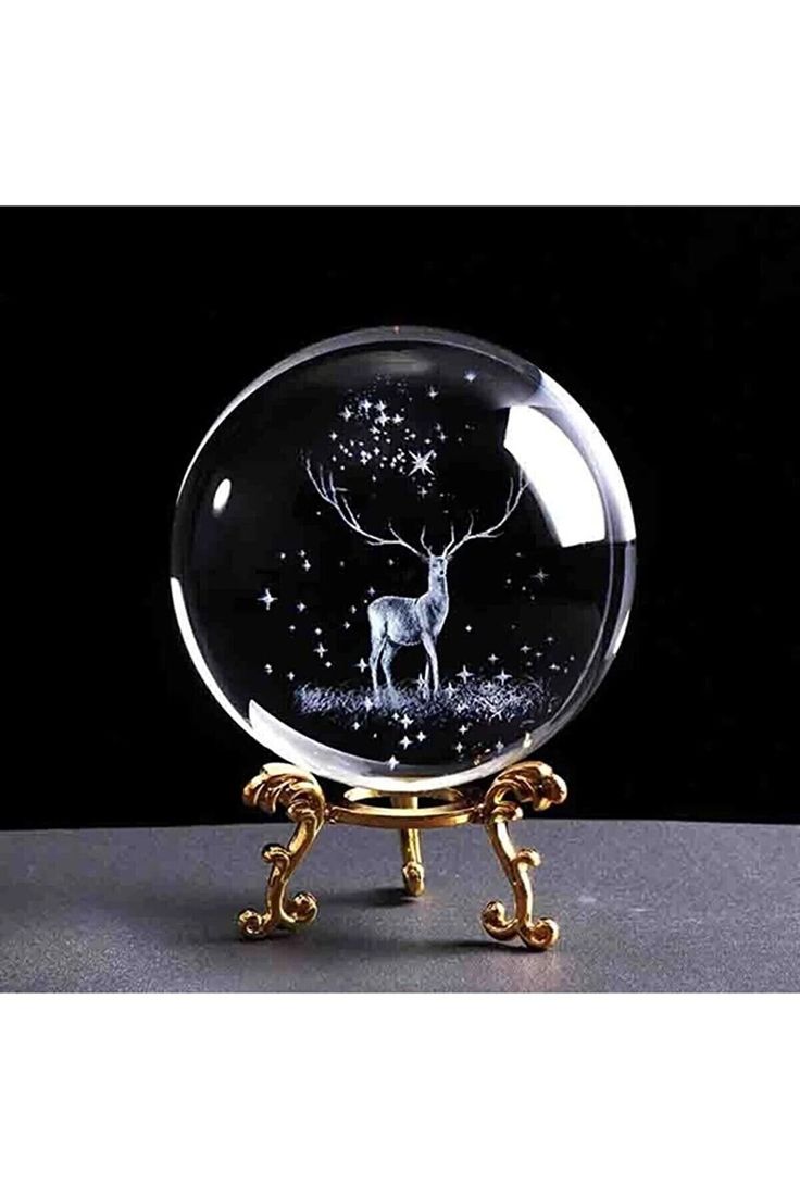 a glass ball with an image of a deer on it