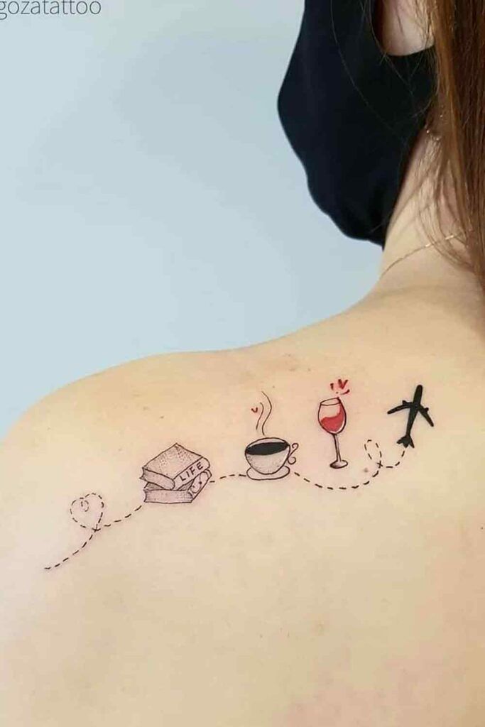 the back of a woman's shoulder with an airplane and coffee cup on it