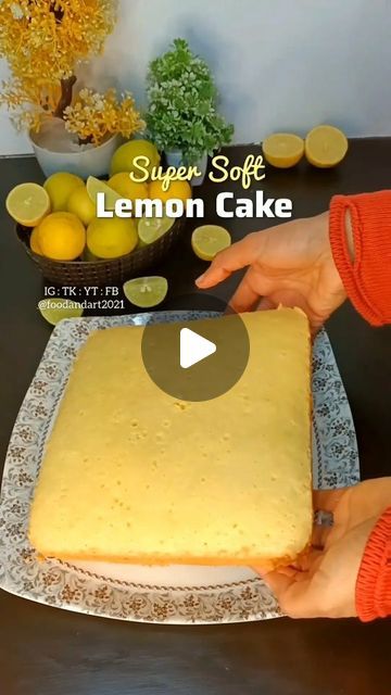 someone is cutting into a lemon cake on a plate