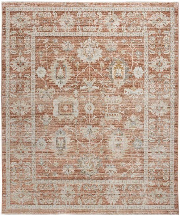 an orange and beige area rug with many different designs on the border, including flowers