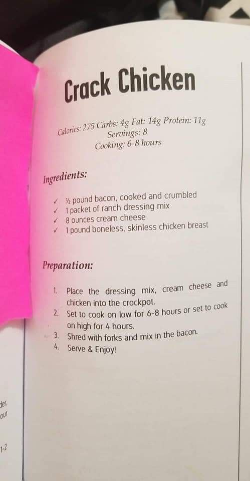 a pink piece of paper that has been placed on top of an open cookbook