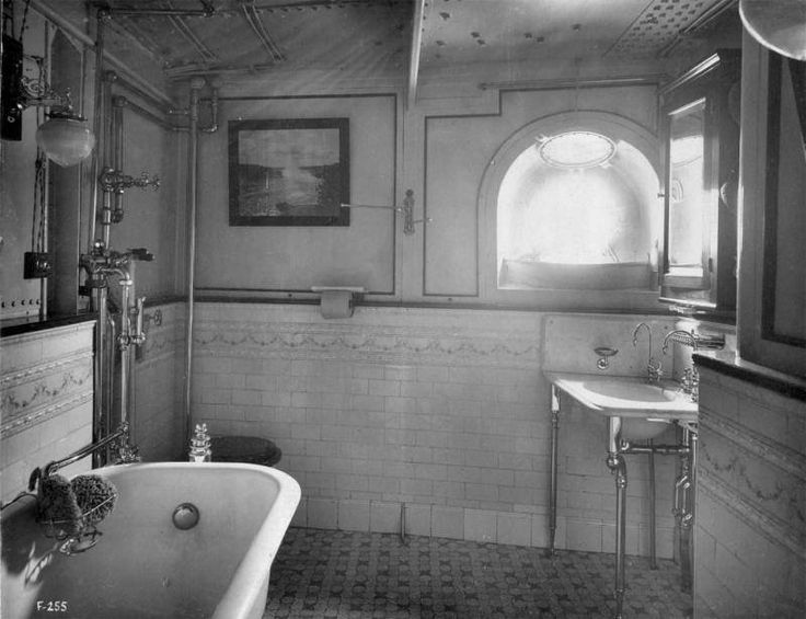 an old photo of a bathtub and sink in a bathroom