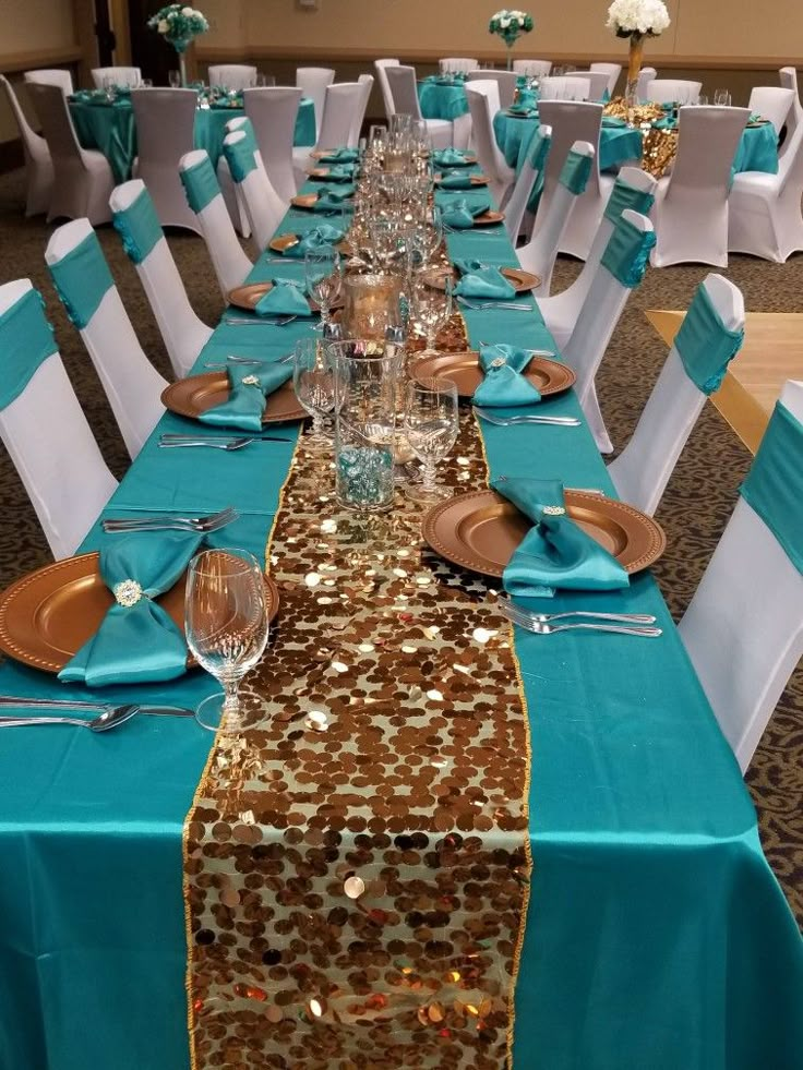 the table is set with blue and gold sequins