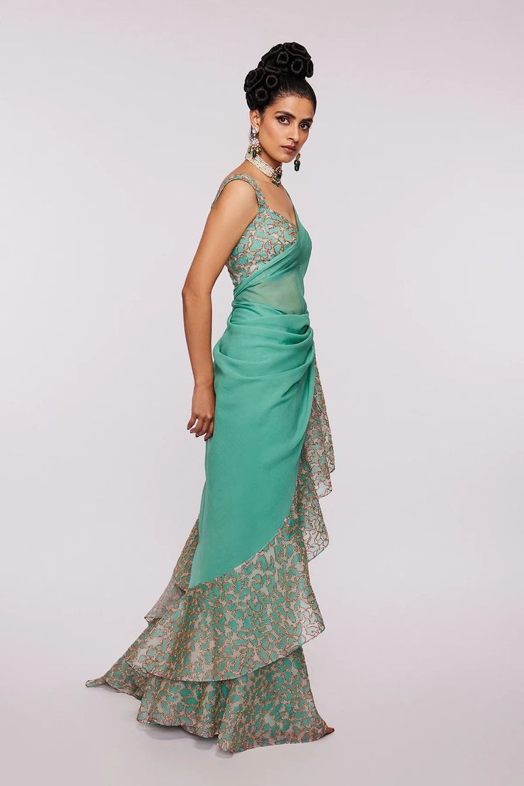 Sea green Divergence animal-printed and embellished organza ruffle saree and blouse.From Aisha Rao's Divergence collection. DELIVERY TIMEPlease allow 6-8 weeks for your outfit to arrive. FABRIC DETAILSIndian Organza. Green Pre-draped Saree With Sheer Dupatta For Evening, Designer Green Dress With Ruffles, Elegant Green Sharara With Ruffles, Elegant Green Ruffled Sharara, Green Silk Pre-draped Saree For Evening, Festive Green Ruffled Saree, Green Silk Evening Saree, Green Georgette Saree With Ruffles, Green Ruffled Saree For Wedding