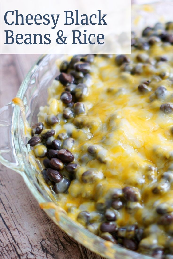 a cheesy black beans and rice casserole in a glass baking dish