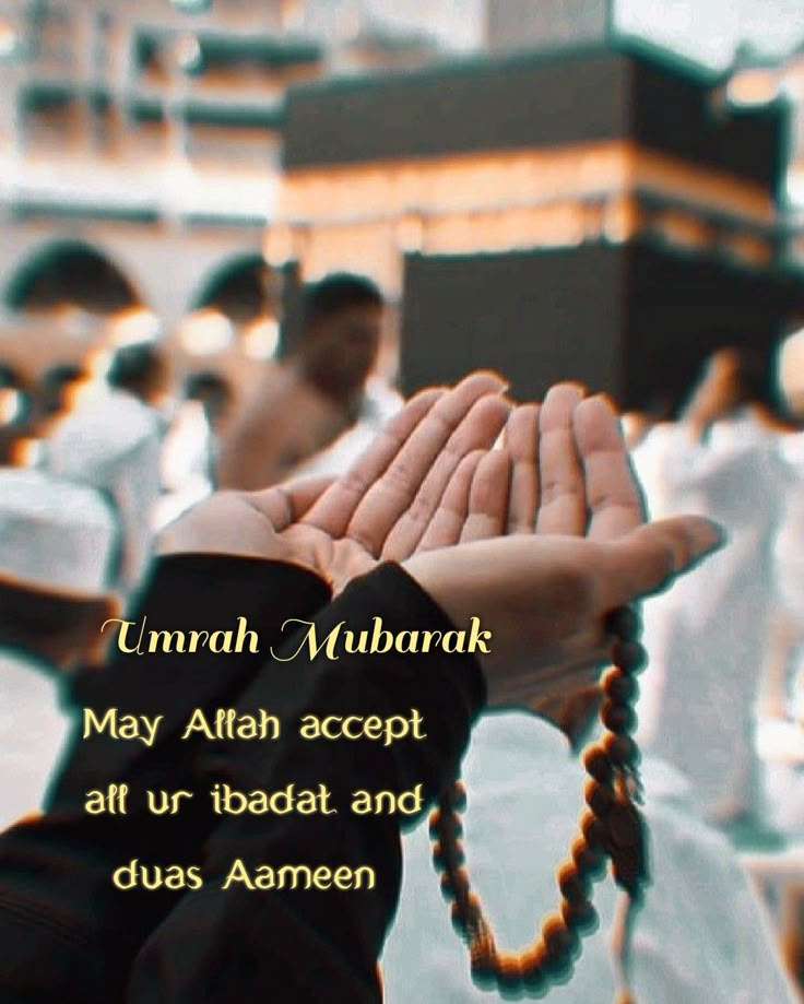 a person holding their hands together in front of a group of people with prayer beads