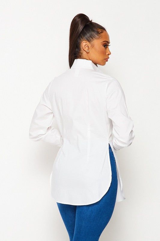 Expertly crafted from high-quality solid cotton, our White Solid Cotton Shirt offers a comfortable and stylish fit with its stretch fabric and long sleeves. The classic button-down design adds a touch of sophistication to any outfit. Perfect for a professional or casual look. Fabric & fit: 97% COTTON 3% SPANDEX Model is wearing size Small. White Solid, Womens Long Sleeve Shirts, Office Outfits, White Shirt, Atom, Capsule Wardrobe, White Undershirt, Chef's Jackets, Cotton Shirt