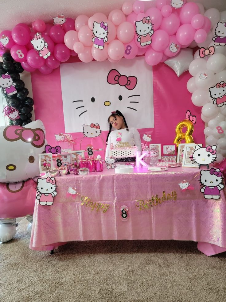 a hello kitty themed birthday party with balloons