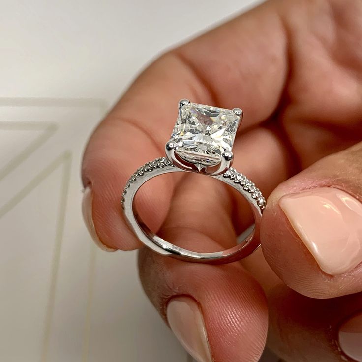 This is why radiant cuts are so popular! They give the most modern twist to classic rectangular cuts. Here is our 3.3-ctw radiant G SI1 engagement ring finished with a band of icy white diamonds. This has her name all over it. 3 Carat Radiant G SI1 Enhanced Diamond with an additional 0.3 Carat Diamonds on the sides. Made in 14K White Gold RING SPECIFICATION Diamond Origin - Natural Earth Mined Total Carat Weight - 3.3 Carat Ring Style - Side Stones Metal Weight - 2.95 Grams Shank Width - 2mm Num 3 Carat Ring, Radiant Cut Diamond Ring, Special Engagement Ring, 3 Carat Diamond, Zierlicher Ring, Pinterest Ideas, Engagement Rings Platinum, Radiant Cut Diamond, Hrithik Roshan