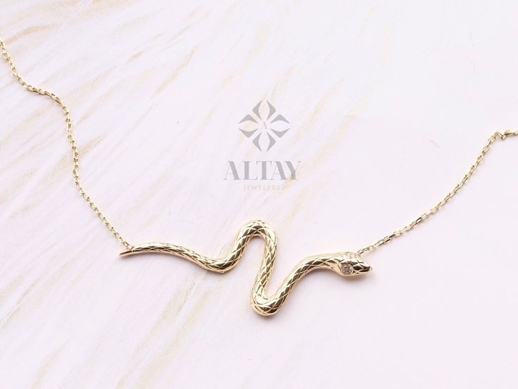 "ABOUT PRODUCT This 14K Gold Snake Necklace is suitable gift for girlfriend, mom and her. You can even buy as a birthday gift for your friends or anniversary gifts, If you want to add a special note we can write for you and put to inside of package. We manufacture our jewelry pieces with carefully and after production we double checking in quality control department. Our main idea is keep our items for daily wearing especially for minimalist jewelry pieces. Minimalist pendant, Cute pendant, Cust Personalized Snake Chain Jewelry As Gift, Snake Chain Jewelry For Valentine's Day Gift, Personalized Jewelry Gift With Snake Chain, Valentine's Day Gift Snake Chain Jewelry, Valentine's Day Gift Snake Chain Necklace, Yellow Gold Snake Shaped Jewelry Gift, Handmade Snake Shape Necklace For Gift, Yellow Gold Snake Shaped Jewelry For Gift, Handmade Snake Shape Necklace Gift