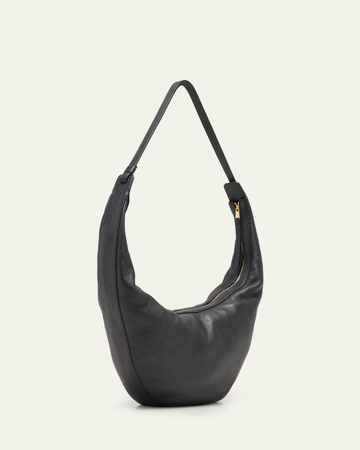 Khaite "Augustina" hobo bag in calfskin leather     Adjustable shoulder strap    Zip top closure     Approx. 8.5"H x 14.5"W x 3"D    Made in Italy Everyday Luxury Soft Leather Shoulder Bag, Luxury Everyday Soft Leather Hobo Bag, Soft Leather Crossbody Hobo Bag For Formal Occasions, Formal Soft Leather Hobo Crossbody Bag, Luxury Shoulder Hobo Bag With Gold-tone Hardware, Chic Everyday Luxury Hobo Bag, Luxury Hobo Shoulder Bag With Gold-tone Hardware, Versatile Evening Shoulder Bag With Leather Lining, Chic Everyday Luxury Hobo Tote Bag