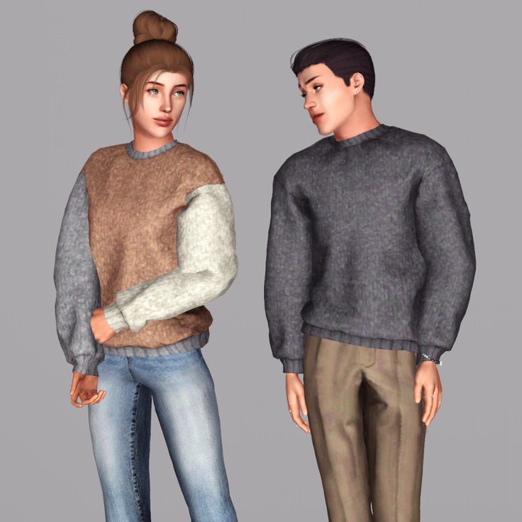 two people standing next to each other wearing sweaters