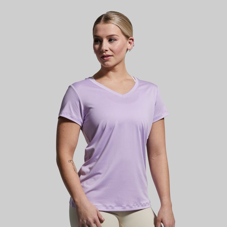 Made to be the most versatile short sleeve v-neck t-shirt in your arsenal. We took your classic, everyday shirt and added extra stretch to give you an unrestricting women's short sleeve athletic shirt you’ll want to wear again and again. Designed specifically for athletic builds and perfect for hitting the gym or heading out to a Saturday barbecue. Compressive Short Sleeve T-shirt For Workout, Moisture-wicking Short Sleeve Gym Shirt, Athletic Heather Short Sleeve T-shirt For Training, Moisture-wicking Short Sleeve T-shirt For Sports, Athletic Heather Short Sleeve T-shirt For Running, Athleisure Shorts, Athletic Build, Athletic Shirts, At The Gym