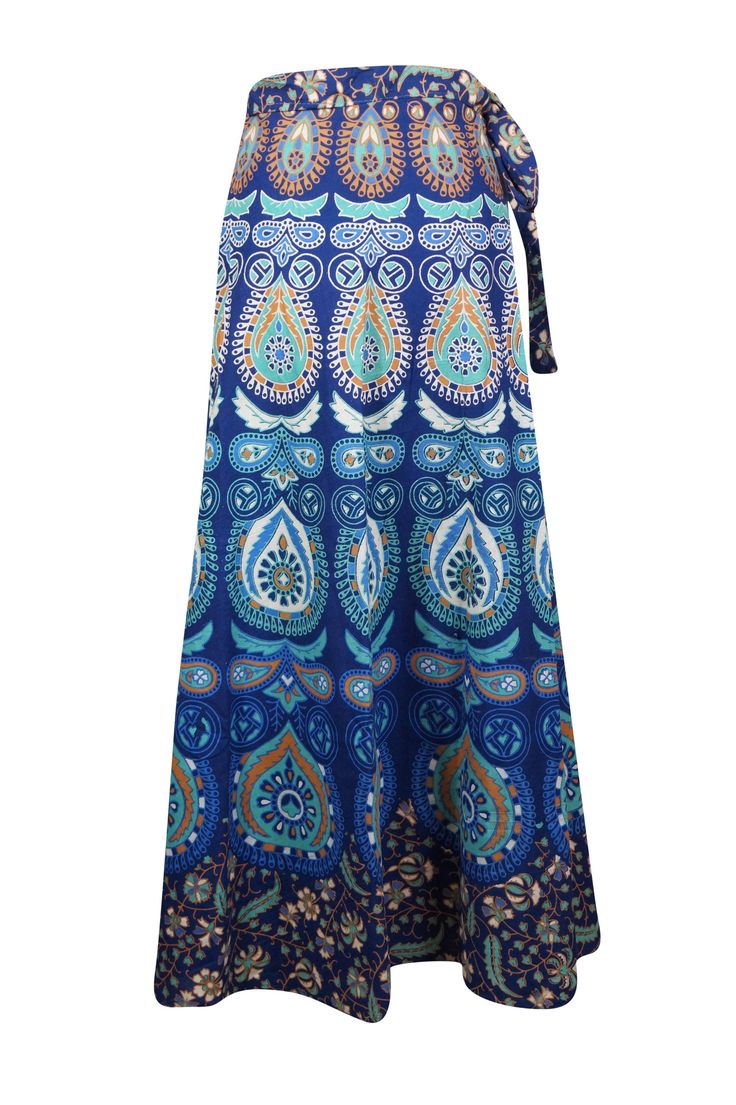 This Women Wraparound Paisley Skirt is perfect for any boho-chic occasion. Crafted with handloom cotton fabric, it features a unique tribal print in striking sea blue hues, and a innovative wraparound style that adds an extra dimension to any wardrobe. One size fits most. SML This Maxi Cotton Wrap Skirt is a unique and stylish way to make a statement. Handmade in handloom cotton, it's a one-size-fits-all, earth-friendly option that's perfect for barbecues, beach walks, or other special occasions Bohemian Batik Print Beach Skirt, Bohemian Cotton Maxi Skirt, Bohemian Blue Maxi Skirt For Beach, Bohemian Cotton Skirt, Blue Flared Maxi Skirt For Vacation, Hippie Blue Maxi Skirt For The Beach, Blue Boho Print Maxi Skirt For Vacation, Turquoise Bohemian Summer Skirt, Bohemian Turquoise Skirt For Summer