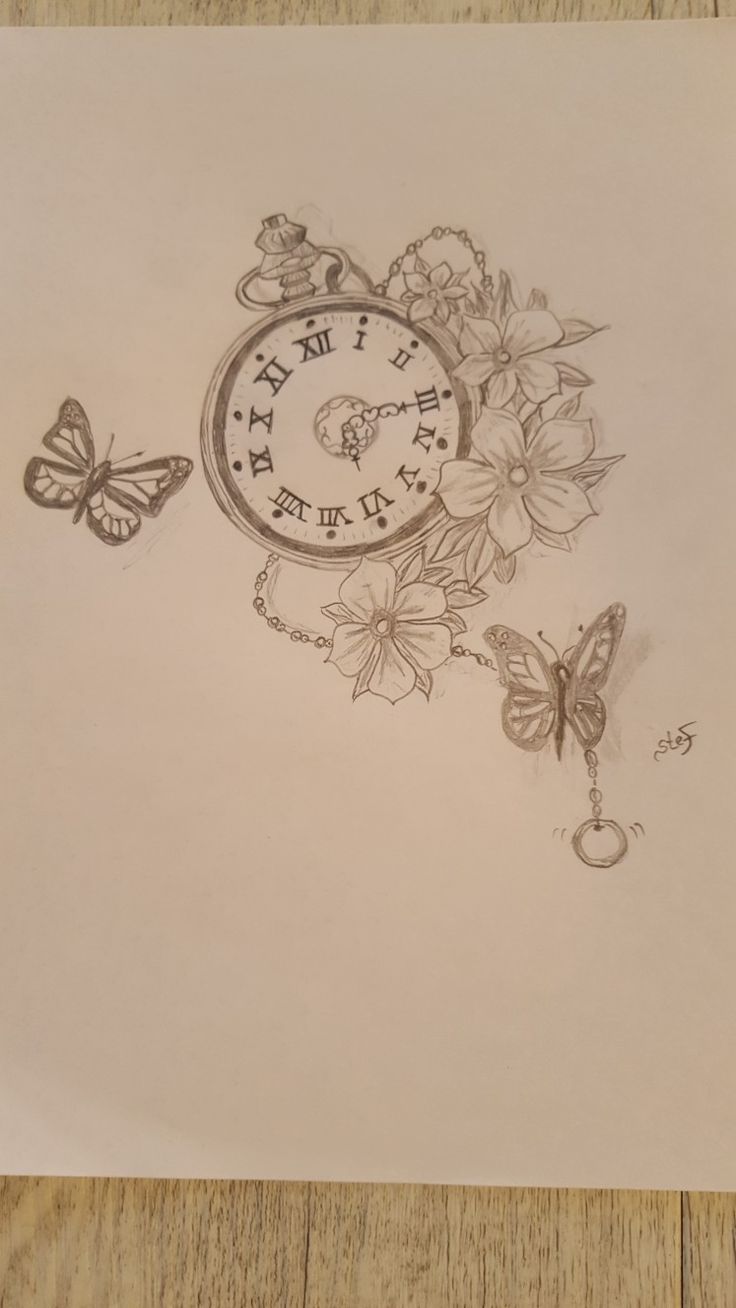 a drawing of a clock with flowers and butterflies around it on top of a piece of paper