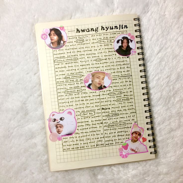 an open notebook with pictures of people and words on the page, which is surrounded by pink flowers