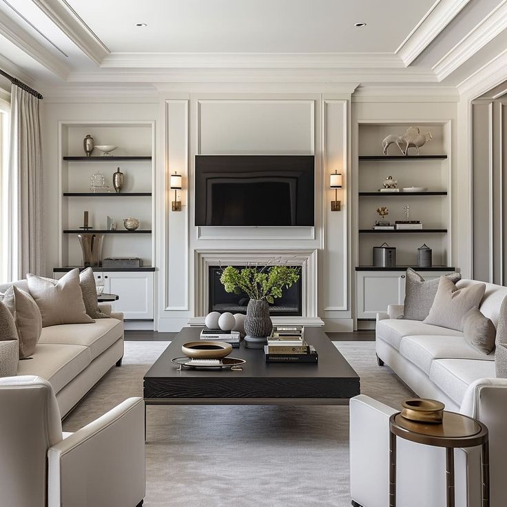 a living room filled with furniture and a flat screen tv mounted on the wall above a fireplace