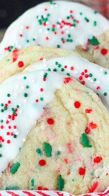 cookies with white frosting and sprinkles in a basket