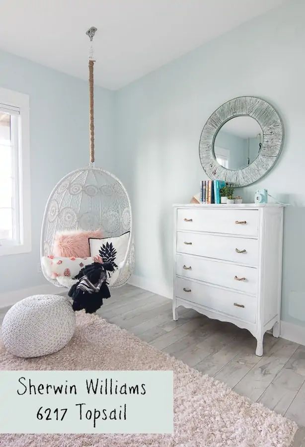 a bedroom with a hanging chair, dresser and chest of drawers in the background that says sheryln williams's 527 topsail