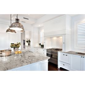 a kitchen with white cabinets and granite counter tops, along with an instagram post about how to use it