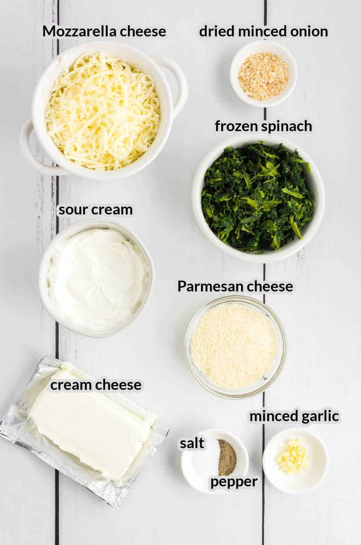 ingredients to make spinach lasagna laid out on a white table