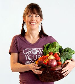 a woman holding a basket full of fresh fruits and vegetables