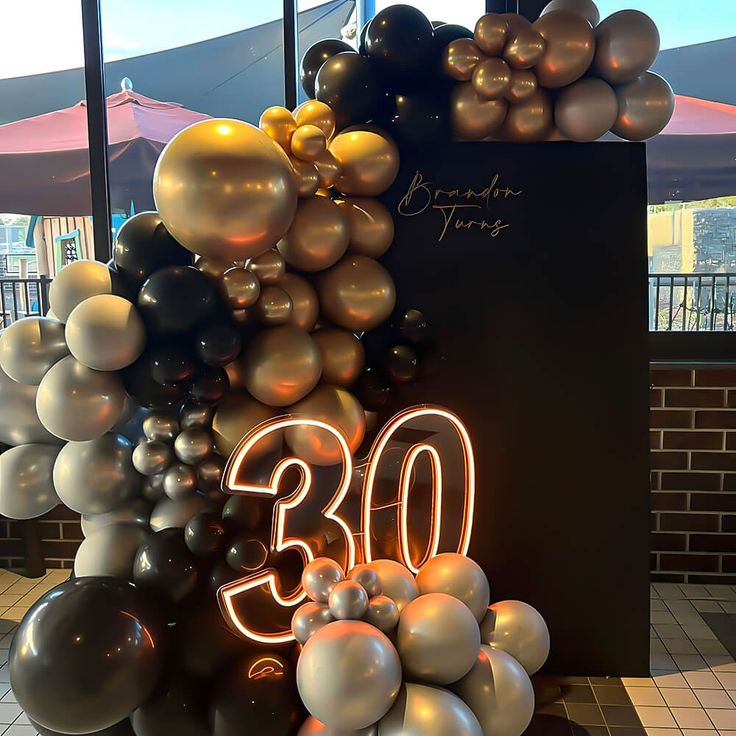 balloons are arranged in the shape of an 30th birthday sign