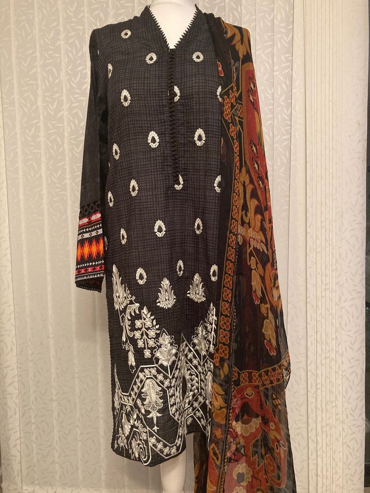 This 3pc suit is from junaid jamshed. Embroidery work done in kameez, dupatta is pure chiffon and trousers is cotton. Chest size is 42 Chanderi Unstitched Suit With Printed Motifs And Long Sleeves, Festive Unstitched Lawn Suit With Printed Motifs, Long Sleeve Cotton Salwar Kameez With Naqshi, Multicolor Georgette Unstitched Suit With Dabka, Multicolor Semi-stitched Cambric Lawn Suit, Long Sleeve Mulmul Unstitched Suit With Dupatta, Unstitched Mulmul Suit With Dupatta And Long Sleeves, Multicolor Cotton Kurta With Naqshi Detailing, Black Unstitched Salwar Kameez In Cambric