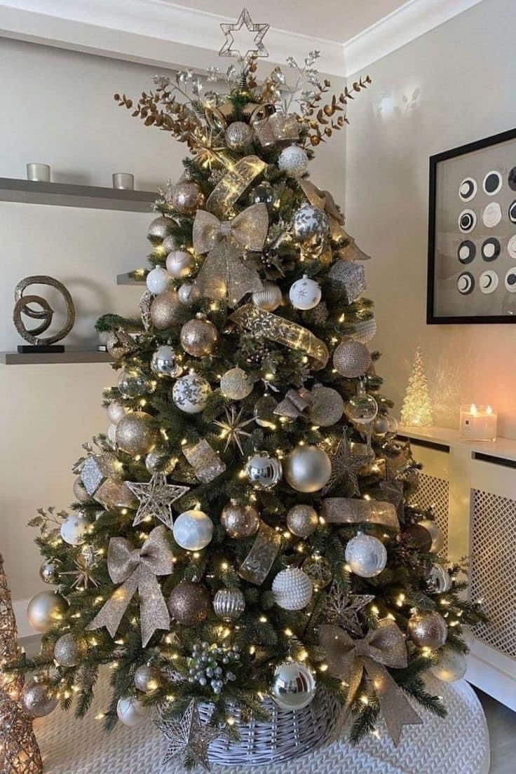 a christmas tree with silver and gold ornaments