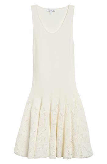 The Parisian label reinterprets a classic silhouette in this skater-style cotton dress shaped with crisp box pleats adorned with intricate piqué lace. Slips on over head Scoop neck 100% cotton Dry clean Made in Italy Designer Clothing Elegant Pleated Cotton Mini Dress, Elegant Cotton Fit And Flare Dresses, Fitted Cotton Dress With Cutwork Hem, Fitted Dress With Cutwork Hem For Daywear, Elegant Fit And Flare Mini Dress For Daywear, Elegant Fitted Dresses With Cutwork Hem, Elegant Mini Dress With Cutwork Hem, Elegant Cotton Fit And Flare Mini Dress, Fitted White Pointelle Knit Dress