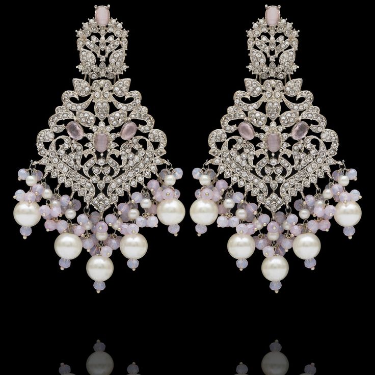 Remarkable heritage jewelry that portrays immaculate precision and technique! Exquisitely crafted earrings with pink and CZ stones along with pink moti and pearl adornments. Approximate earrings length is 4". Silver-plated on high-quality brass as base metal. Made by order. Kindly allow 5-7 weeks for the delivery of this item. For custom or urgent requests, please contact support@alacouture.com. *Please Note: We use faux stones and beads in all of our jewelry. Luxury Victorian Chandelier Earrings, Luxury Ornate Pierced Chandelier Earrings, Glamorous Pink Rhinestone Crystal Earrings, Pink Crystal Chandelier Earrings, Elegant Nickel-free Pink Chandelier Earrings, Unique Gift Cards, Heritage Jewellery, Create Words, Faux Stone