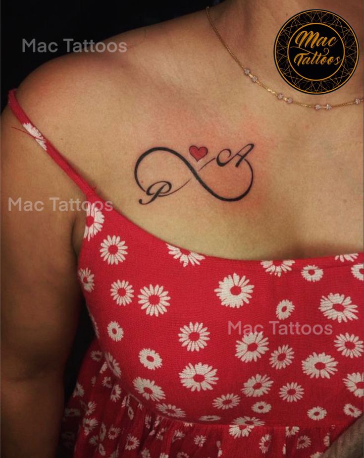 a woman with a tattoo on her chest and the word love is written in cursive