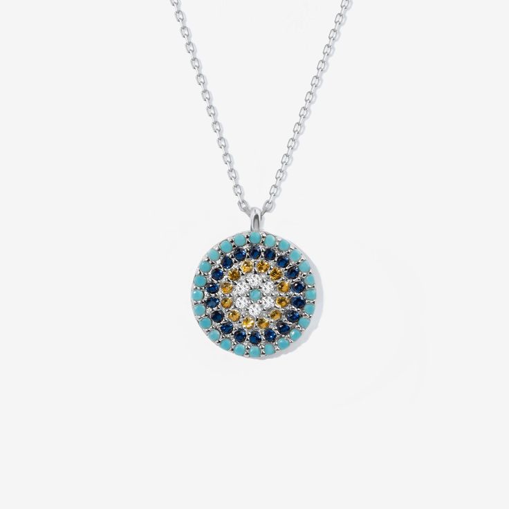 Round Evil Eye Necklace This Round Evil Eye Necklace in 14K Gold is a stunning piece of jewelry that is sure to make a statement. The intricate design features a large evil eye pendant with a blue enamel at the center all set in 14K gold. Perfect for adding a touch of glamour to any outfit. You'll have: 14k solid gold handcrafted pieces 100% US sourced jewelry Size Material: 14k Solid Gold Stone: Cubic Zirconia Height: 14 mm / 0.55 in Width: 11 mm / 0.43 in Chain Style: Cable Chain Chain Length: Round Evil Eye, Protection Necklace, Gold Piece, Eye Pendant, Evil Eye Pendant, Diamonds And Gold, Gold Stone, Evil Eye Necklace, Eye Necklace