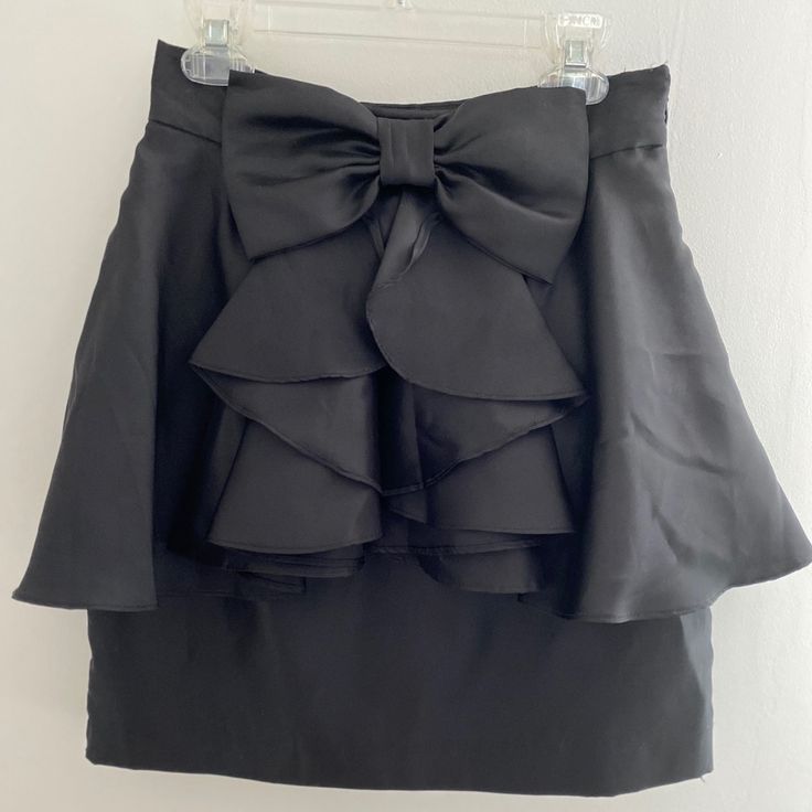 Adorable Bow Black Skirt, Never Worn Nwt Chic Ruffled Skort For Party, Elegant Ruffled Skort For Party, Trendy Party Skort With Ruffled Skirt, Trendy Ruffled Skort For Party, Chic Party Skort With Flowy Skirt, Chic Party Skort With Tiered Skirt, Chic Flowy Skort For Party, Forever 21 Mini Skirt For Night Out, High Waist Ruffled Skort For Party