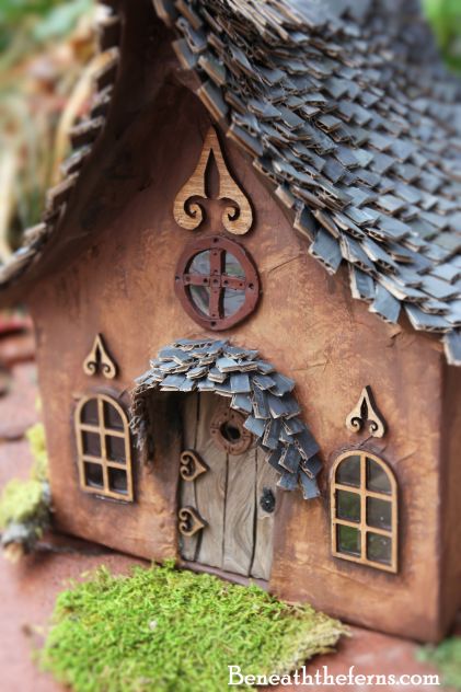 a close up of a small house made out of wood