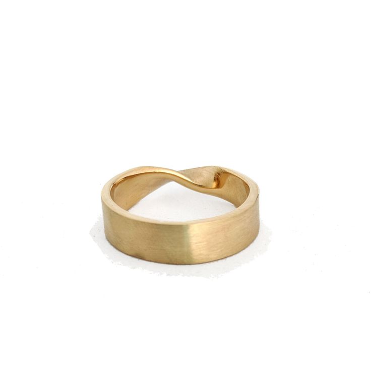 Who doesn't love a simple mobius strip, its a great simple change from a streamline band. The one pictured here is made of solid 14k yellow gold but can be made in other karats, colors and nickle free options, feel free to convo me for a quote. This ring measures 6mm wide by 1.5mm thick. It is pictured with a brushed finish with a polished edge but is also available in an all polished or all brushed. This ring will be hallmarked. I can make this ring in full, half and quarter sizes as, just let Modern Twist Wide Band Rings With Polished Finish, Elegant Rings With Tension Setting And Thick Band, Elegant Jewelry With Thick Band Tension Setting, Modern Wide Band Ring With Polished Finish, 14k Gold Rings With Tension Setting And Modern Twist, Minimalist Wide Band For Formal Occasions, Minimalist Formal Wide Band, Modern Infinity Rings With Polished Finish, Modern Twist Wide Band Rings As A Gift